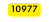 10977
