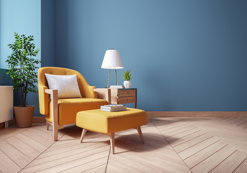 Modern Vintage interior of living room,,Blueprint home decor concept ,yellow armchairs with wood table on blue wall and Hardwood Flooring ,3d render